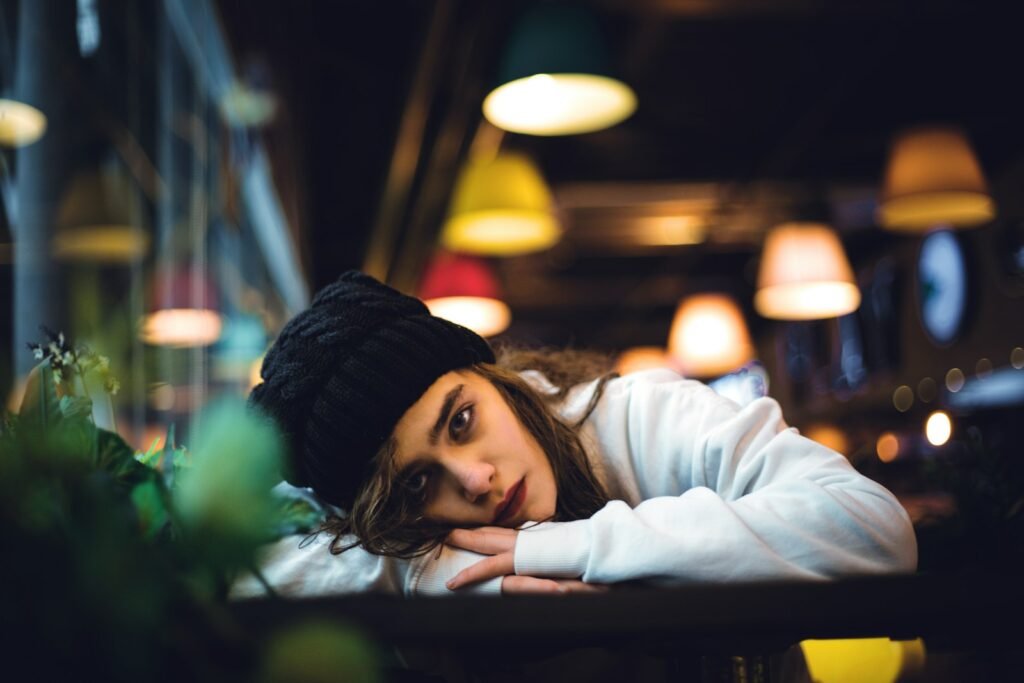 a woman sitting at a table in a restaurant